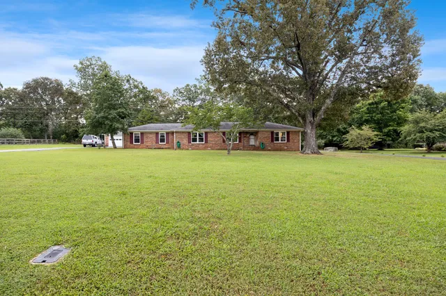 a view of a large body of water with a building in the background