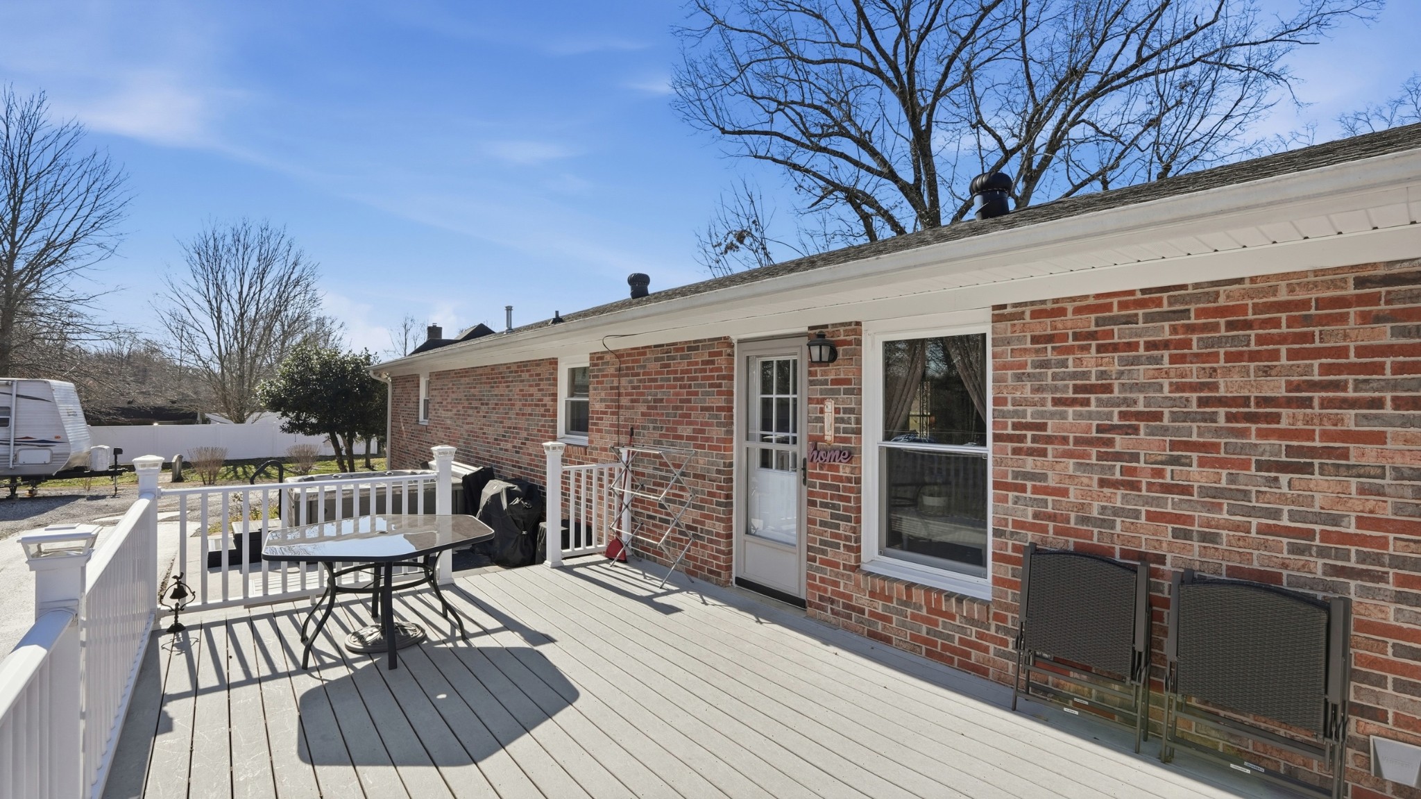 509 12 Oaks Road Tullahoma, TN 37388 - Photo 44 of 60 a view of a patio with table and chairs and wooden floor