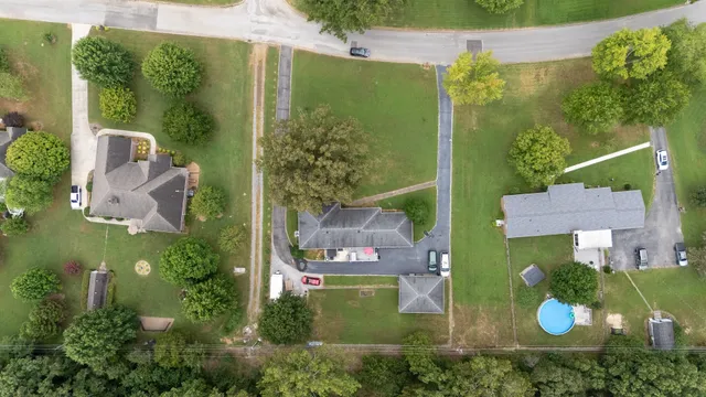 an aerial view of a house with outdoor space