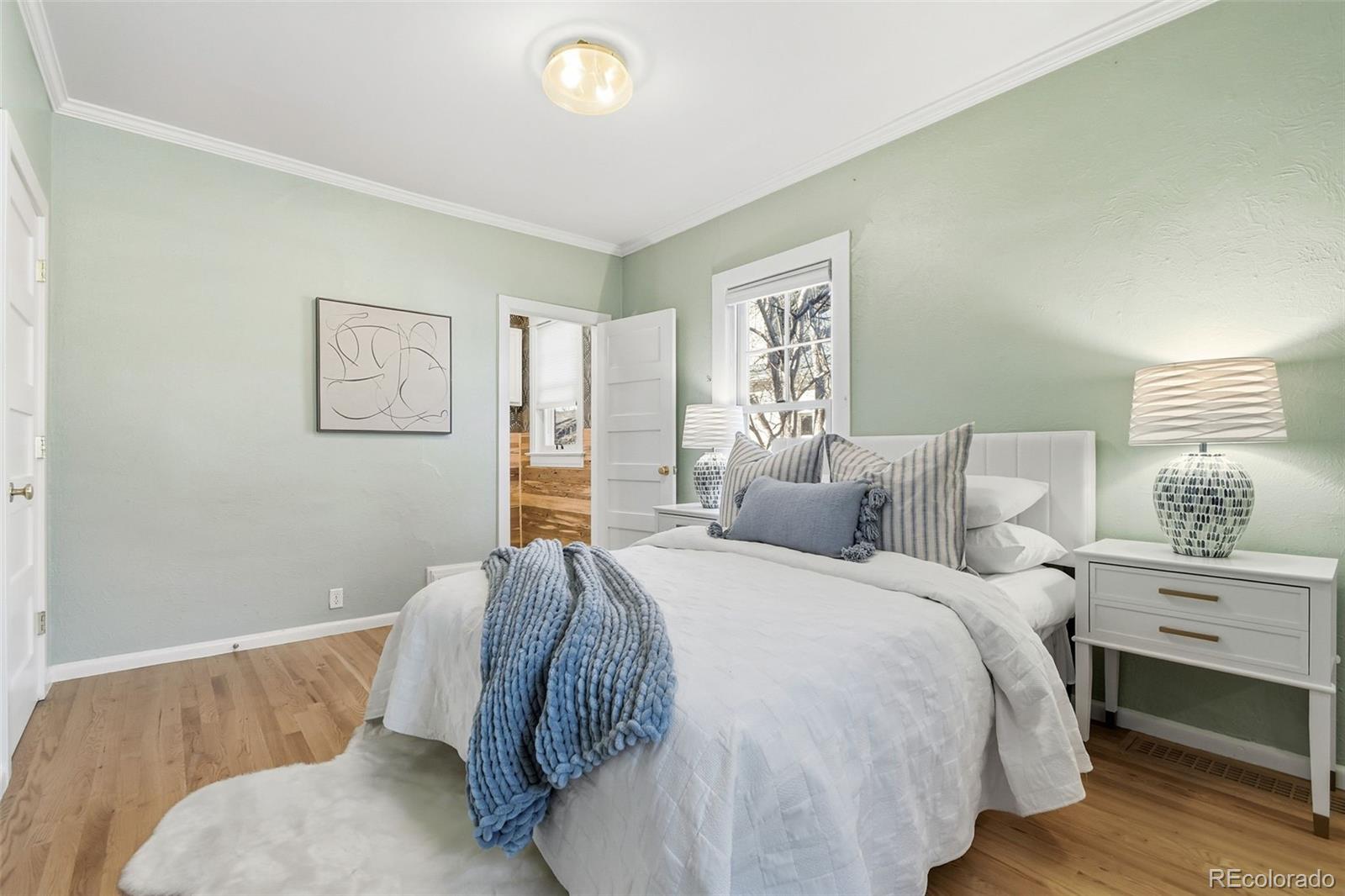 1318 South York Street Denver, CO 80210 - Photo 26 of 49 a bed room with a bed and a window