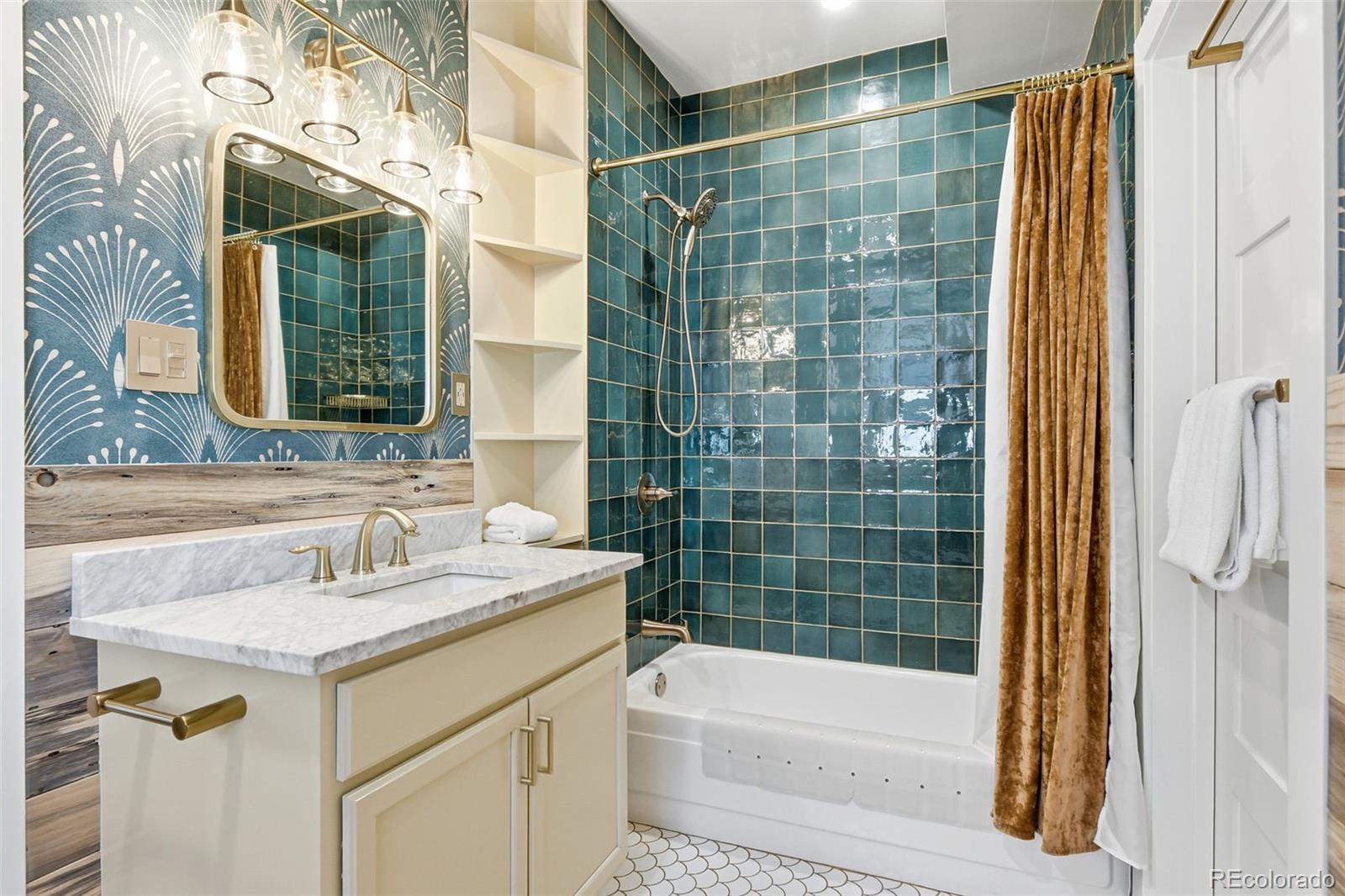 1318 South York Street Denver, CO 80210 - Photo 27 of 49 a bathroom with a sink and a mirror