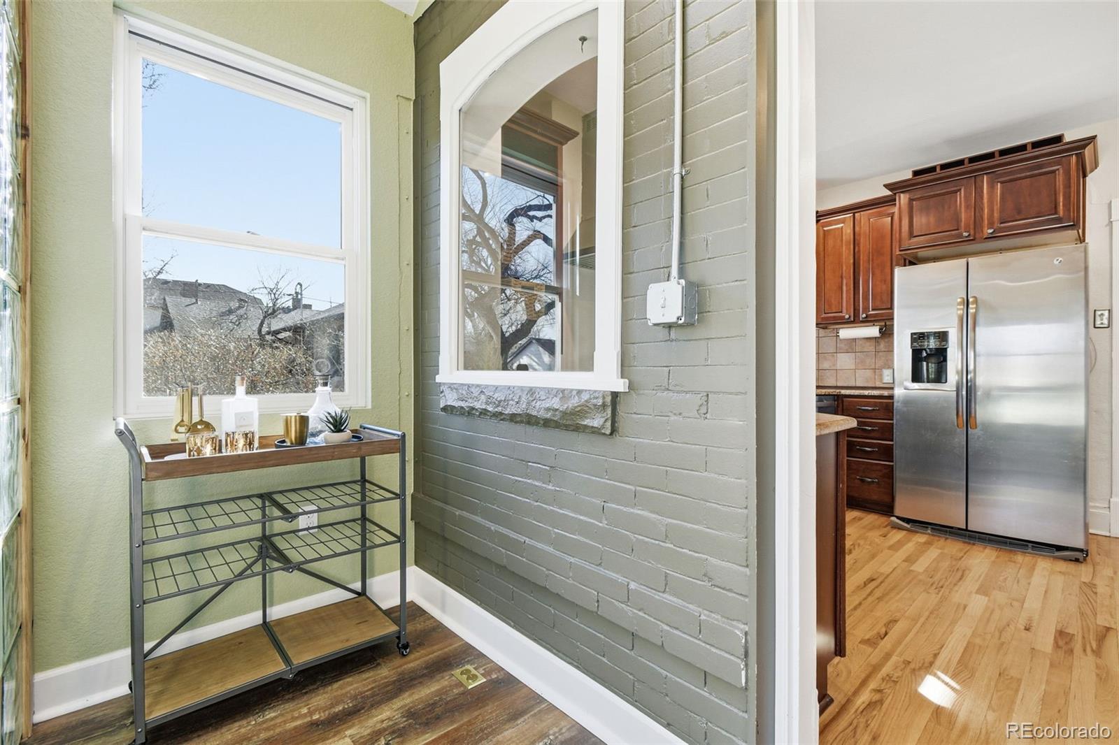 1318 South York Street Denver, CO 80210 - Photo 30 of 49 a room with a table and a chair