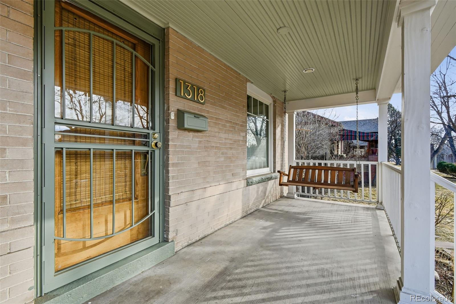 1318 South York Street Denver, CO 80210 - Photo 3 of 49 a view of a balcony with a door