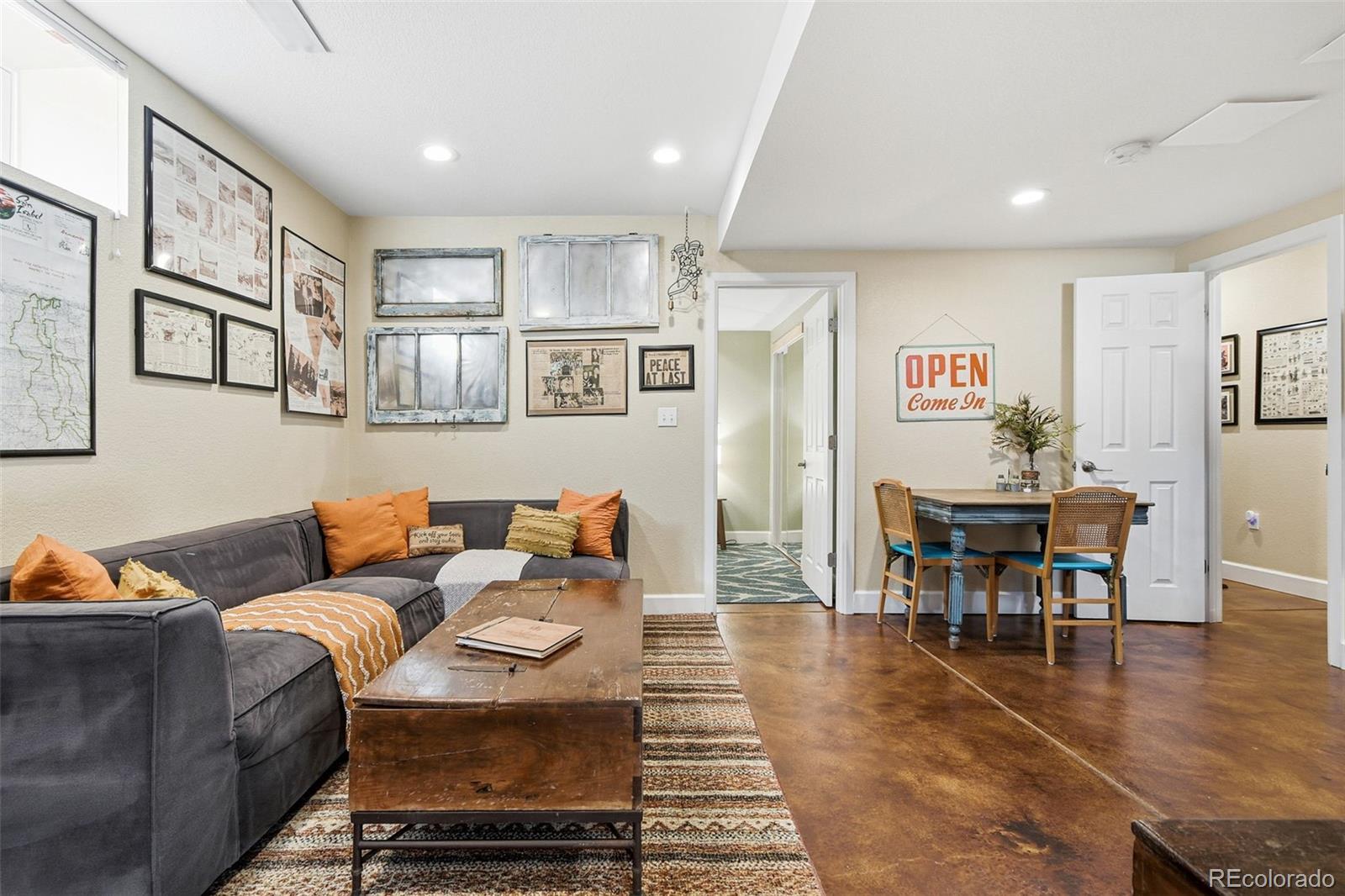 1318 South York Street Denver, CO 80210 - Photo 34 of 49 a living room with furniture and wooden floor