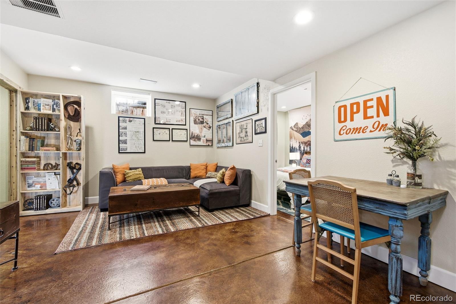 1318 South York Street Denver, CO 80210 - Photo 36 of 49 a living room with furniture and a potted plant