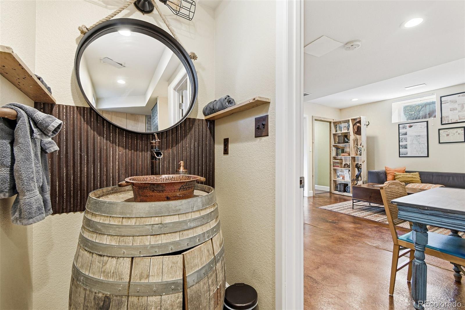 1318 South York Street Denver, CO 80210 - Photo 40 of 49 a living room with furniture and a mirror