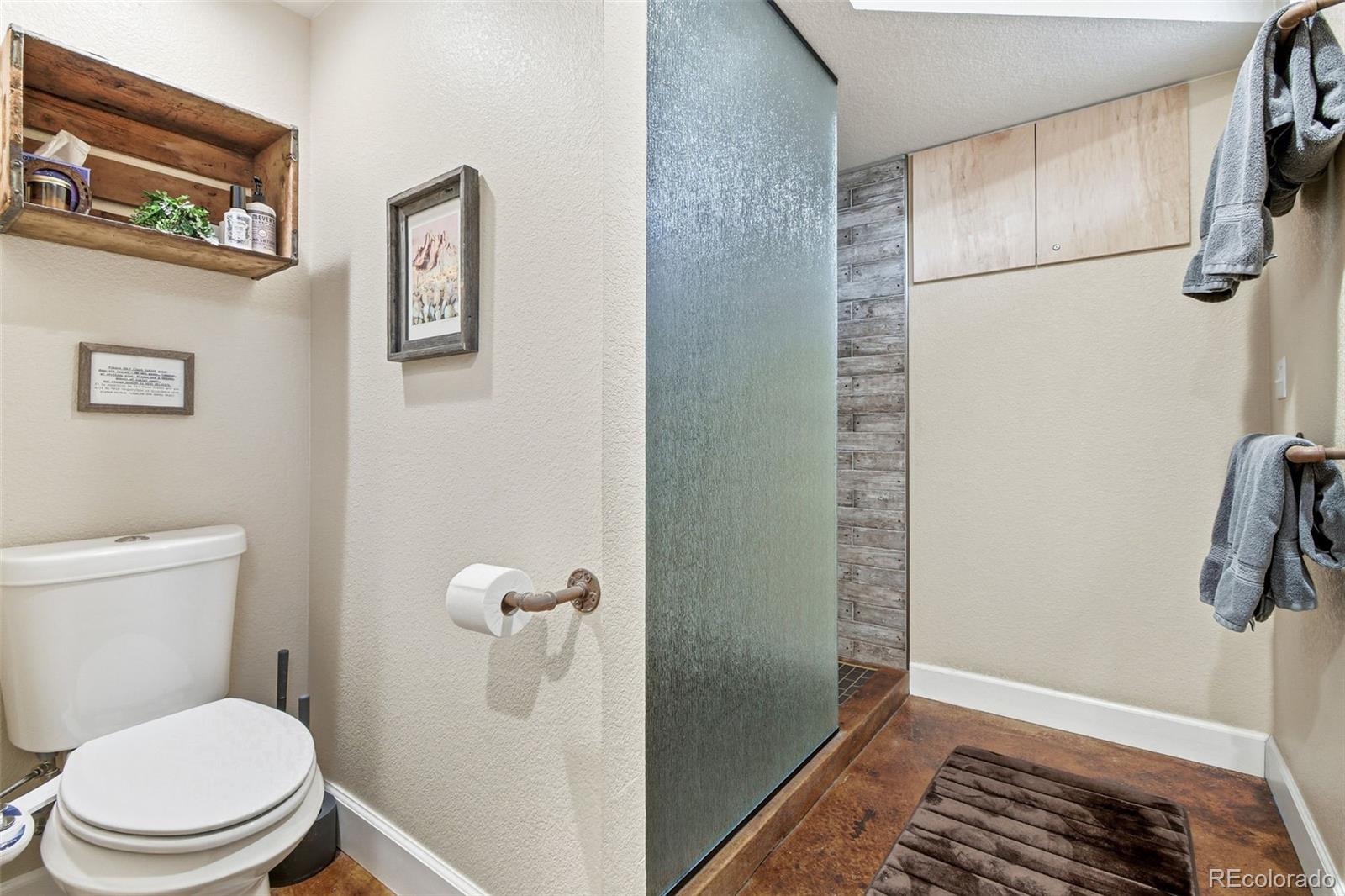 1318 South York Street Denver, CO 80210 - Photo 42 of 49 a bathroom with a toilet and a shower