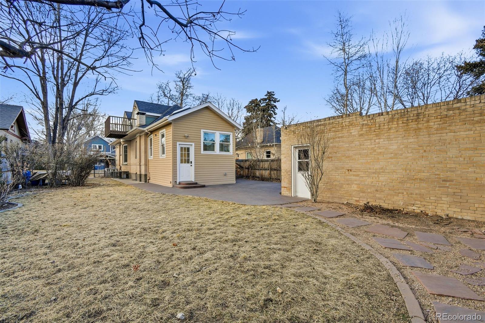1318 South York Street Denver, CO 80210 - Photo 45 of 49 a view of a house with a yard