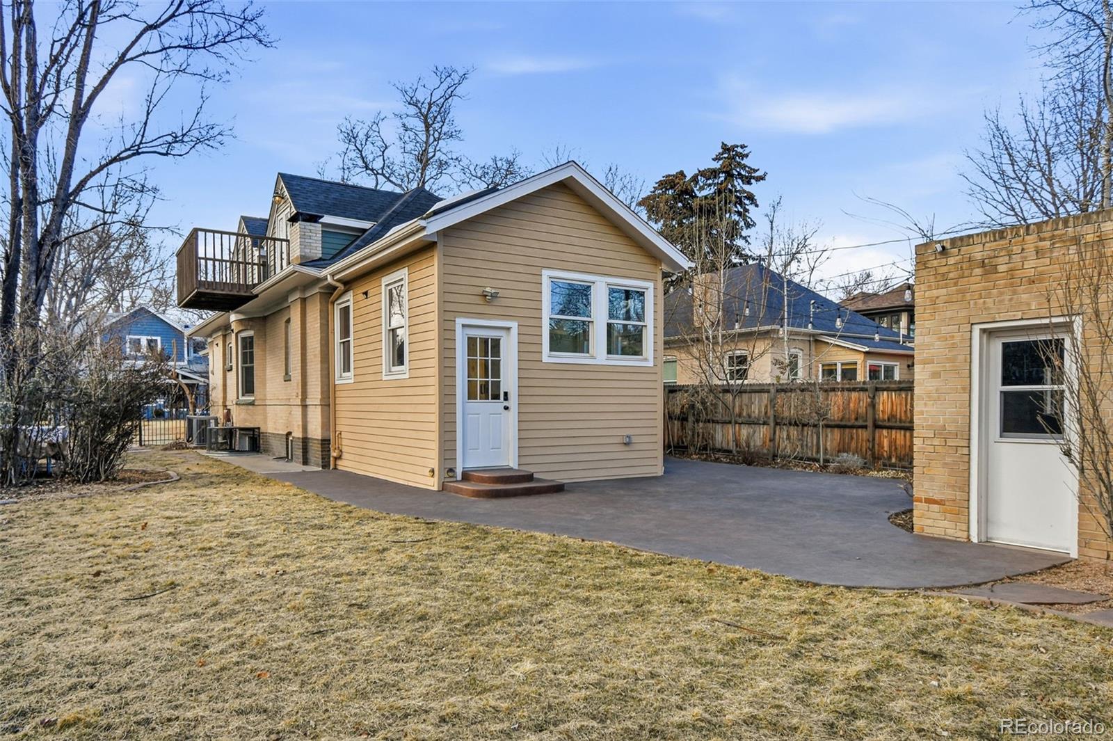 1318 South York Street Denver, CO 80210 - Photo 46 of 49 a view of a house with a yard