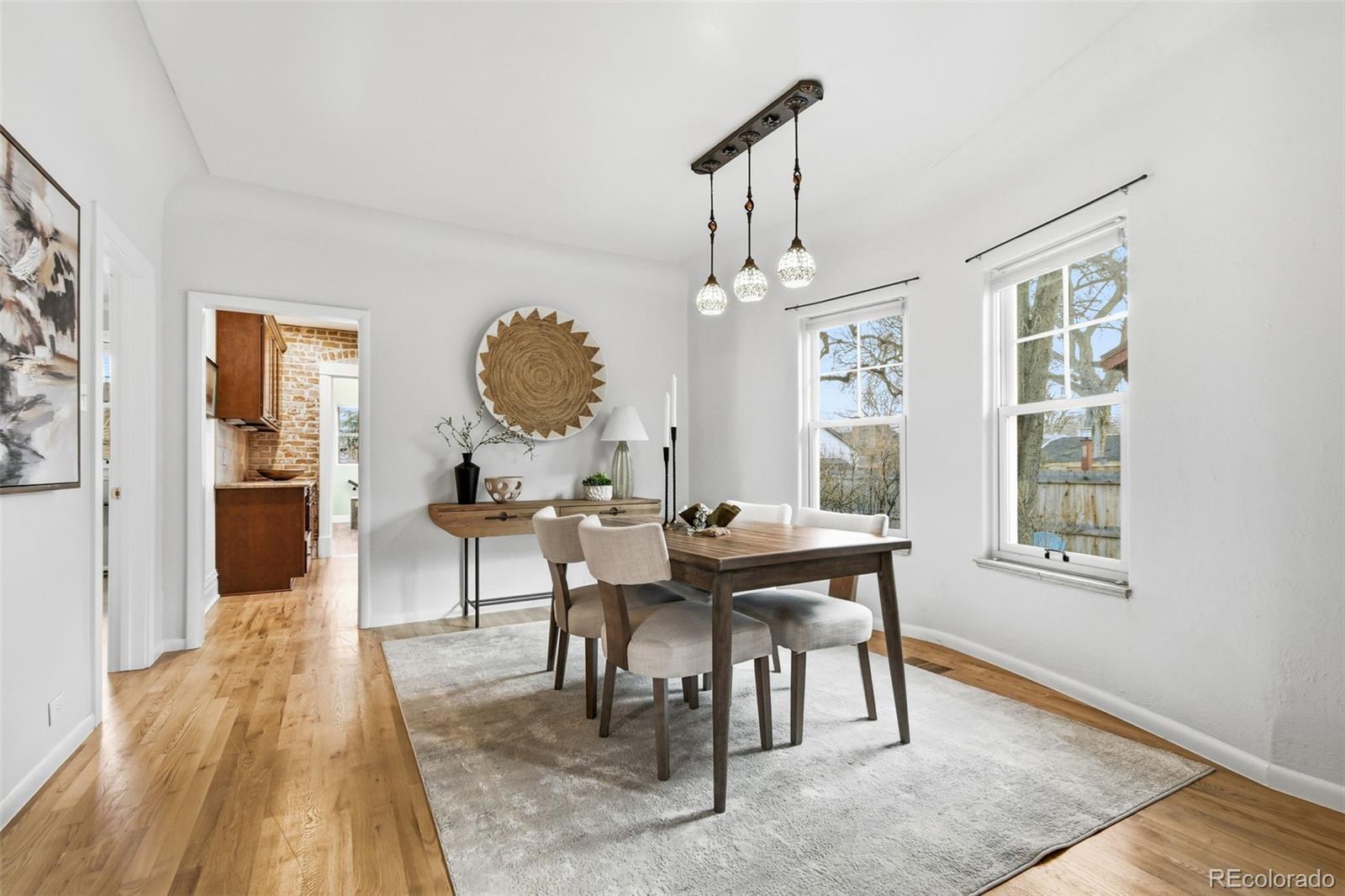 1318 South York Street Denver, CO 80210 - Photo 9 of 49 a view of a dining room with furniture