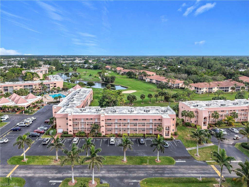 175 Turtle Lake Court, Unit 310 Naples, FL 34105 - Photo 2 of 34 Drone / aerial view with a water view