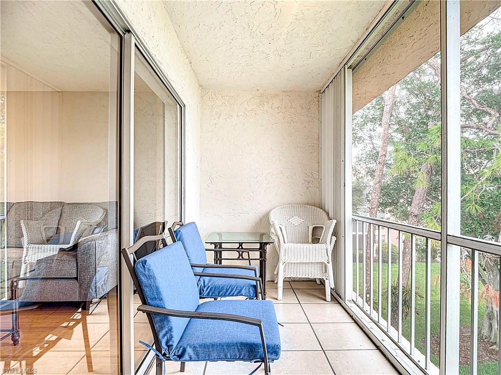 175 Turtle Lake Court, Unit 310 Naples, FL 34105 - Photo 28 of 34 Sunroom featuring plenty of natural light