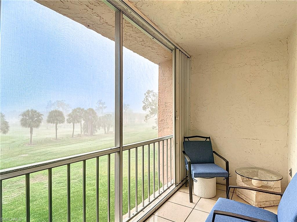 175 Turtle Lake Court, Unit 310 Naples, FL 34105 - Photo 30 of 34 View of unfurnished sunroom