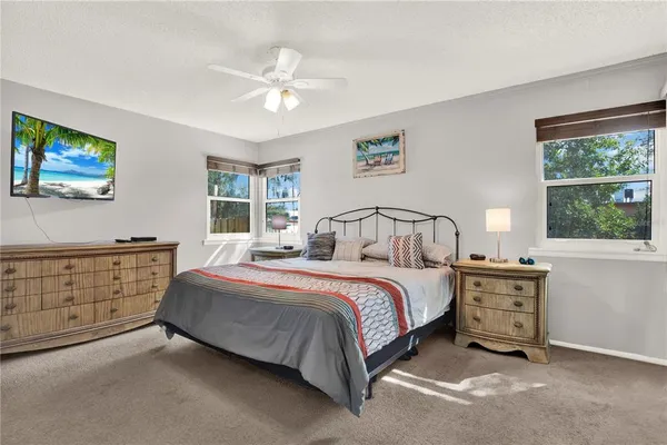 a bed room with a bed and a window