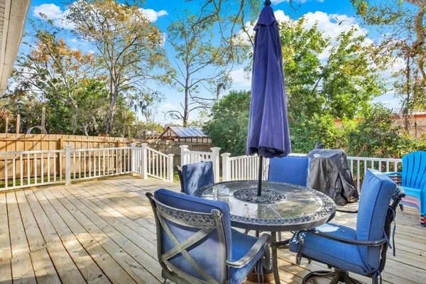 a view of a table and chairs on the roof deck