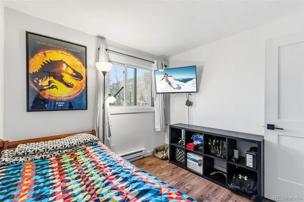 a room with toys and a wooden floor