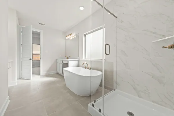 a bathroom with a bathtub and shower