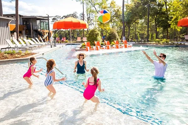 a view of swimming pool with a table and chairs