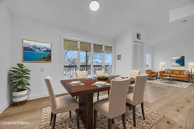a view of livingroom with kitchen and a sink