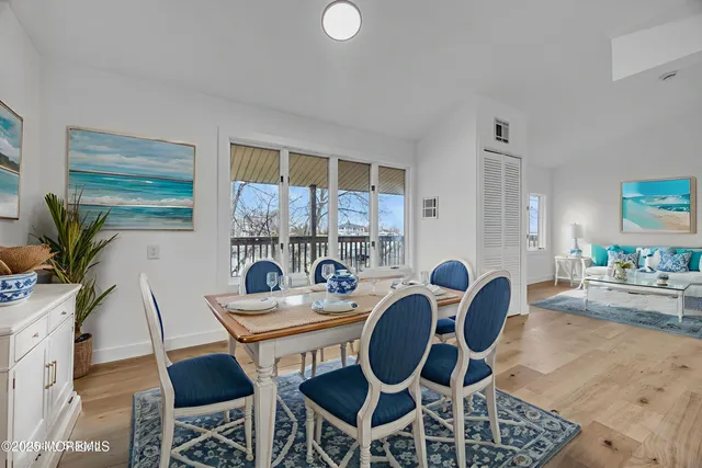 a living room with furniture flat screen tv and a fireplace