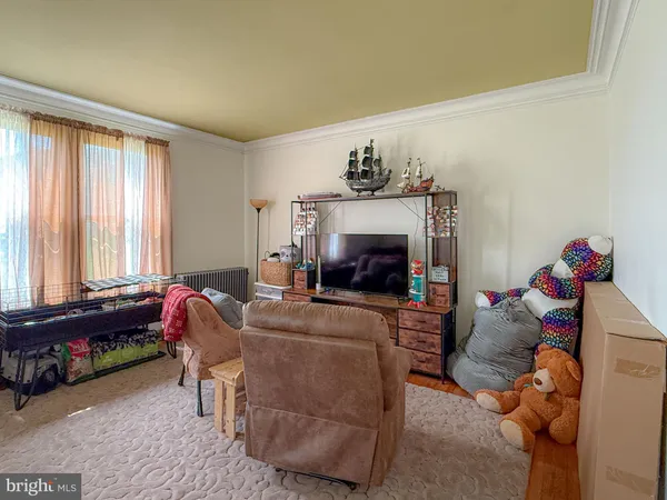 a living room with furniture a window and a fireplace