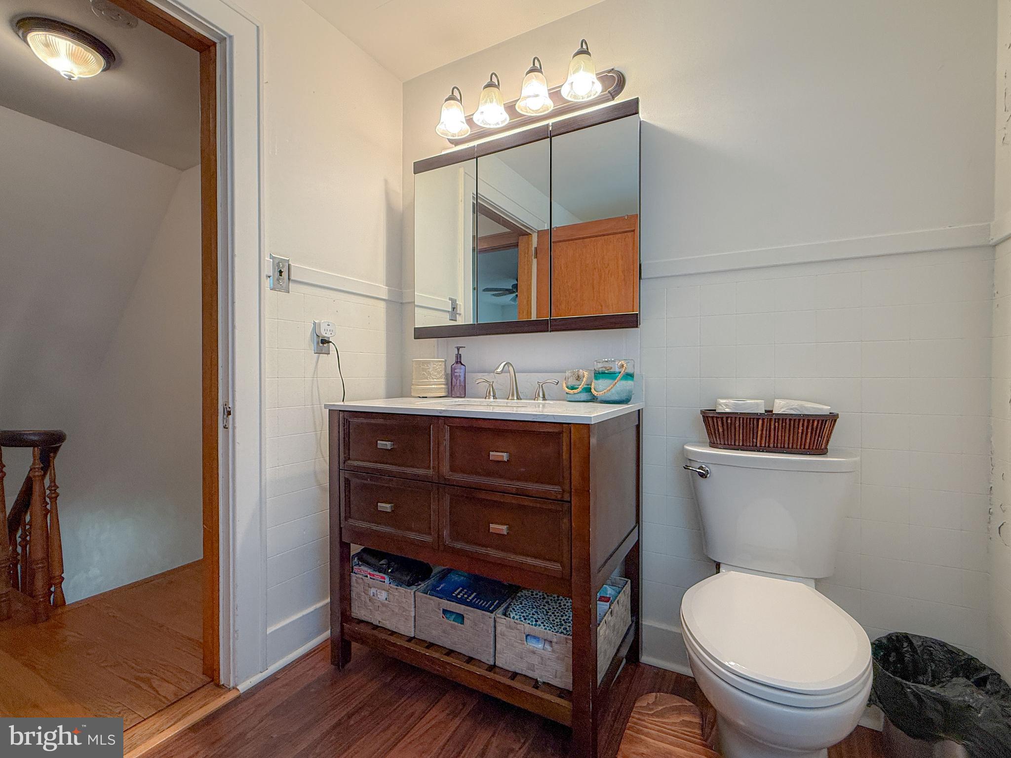 930 Osman Road Alum Bank, PA 15521 - Photo 17 of 63 a bathroom with a toilet a sink and mirror