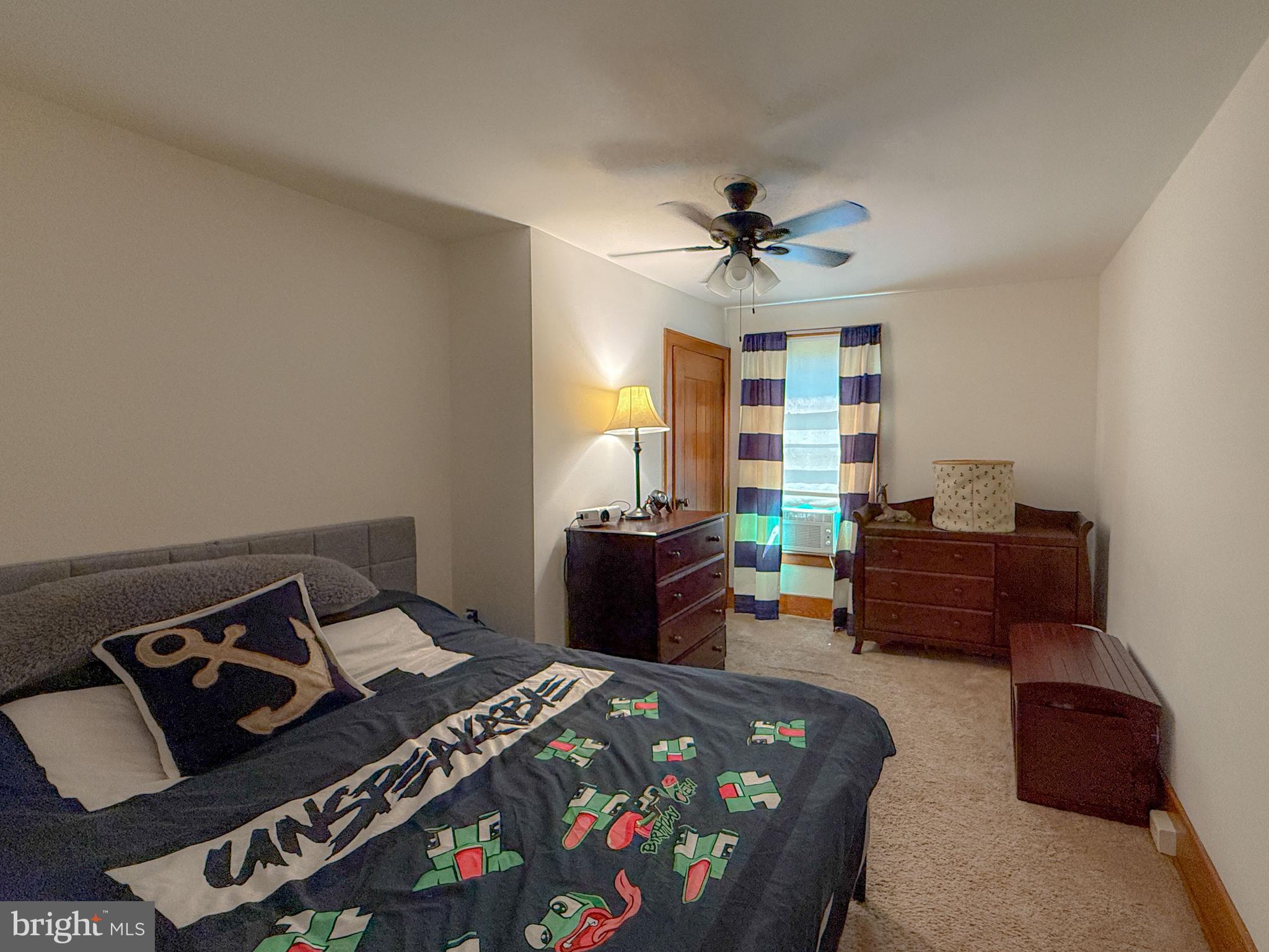 930 Osman Road Alum Bank, PA 15521 - Photo 24 of 63 a bedroom with furniture and a chandelier