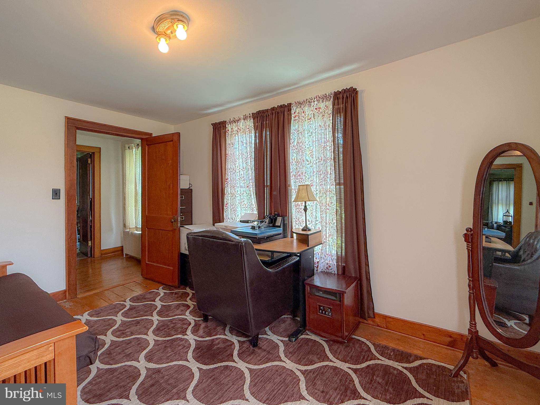 930 Osman Road Alum Bank, PA 15521 - Photo 25 of 63 a room with furniture and a window