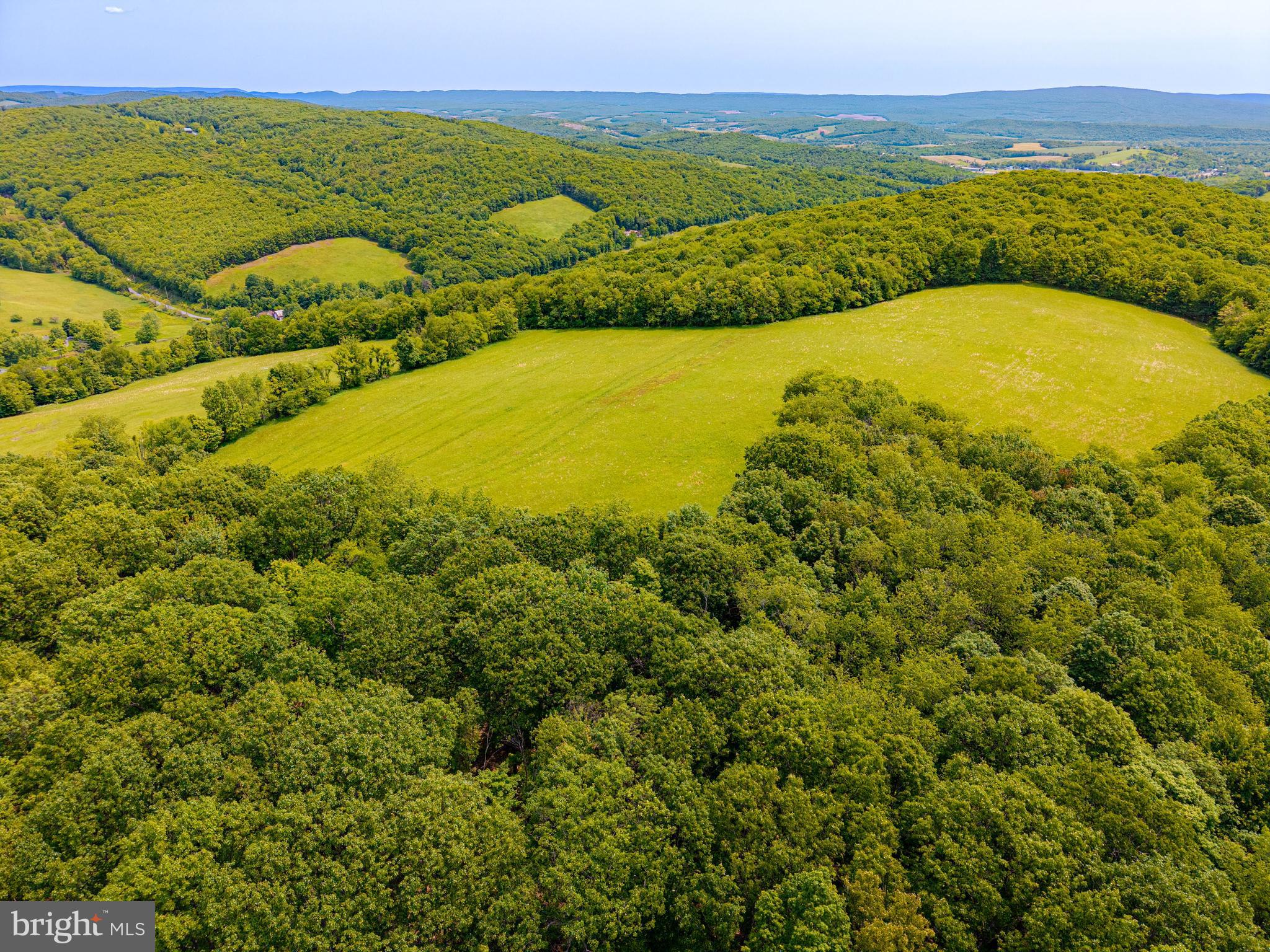 930 Osman Road Alum Bank, PA 15521 - Photo 58 of 63 a view of a lake with a mountain