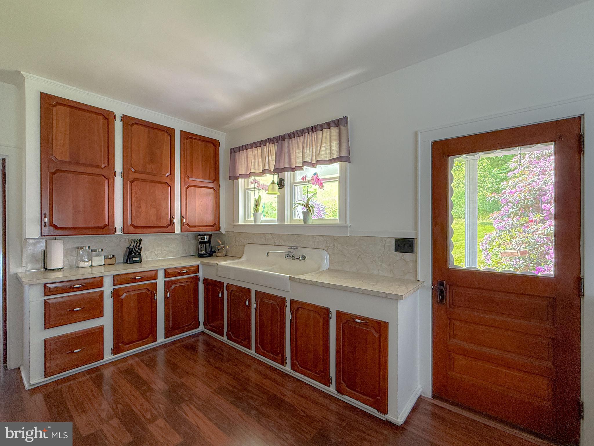 930 Osman Road Alum Bank, PA 15521 - Photo 6 of 63 a kitchen with a stove sink and cabinets