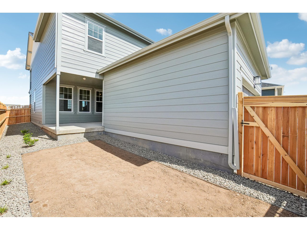 4516 Burl Street Timnath, CO 80547 - Photo 42 of 46 Side yard with wood fencing and partial landscaping