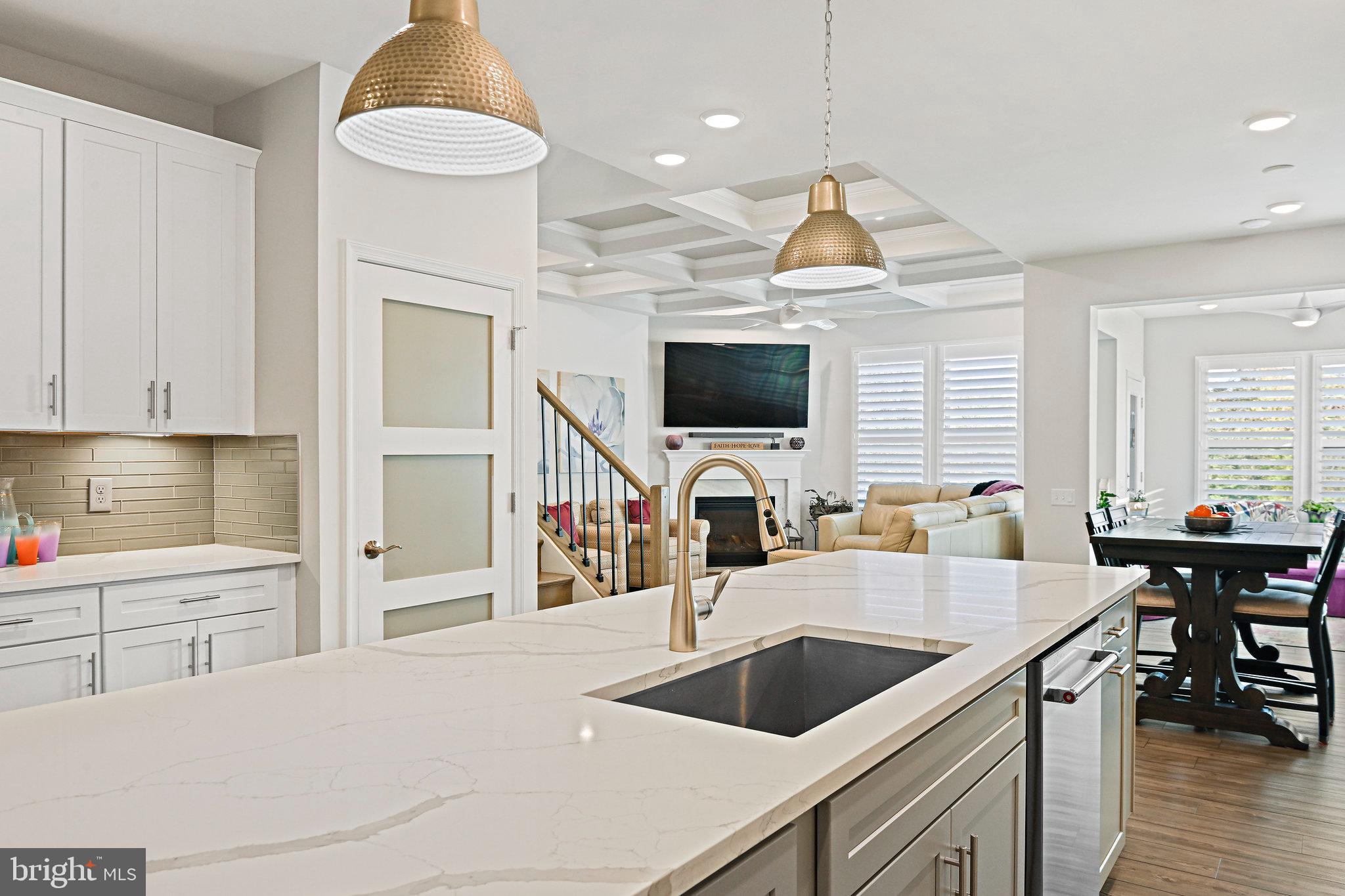 15788 Gardenia Rdg Way Haymarket, VA 20169 - Photo 15 of 50 a kitchen with a sink cabinets and a wooden floor