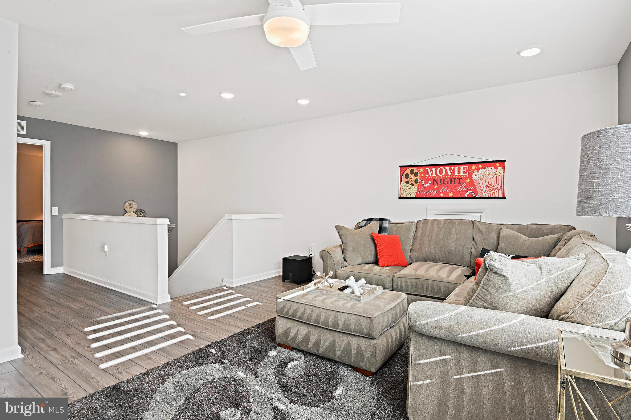 15788 Gardenia Rdg Way Haymarket, VA 20169 - Photo 25 of 50 a living room with furniture and a couch