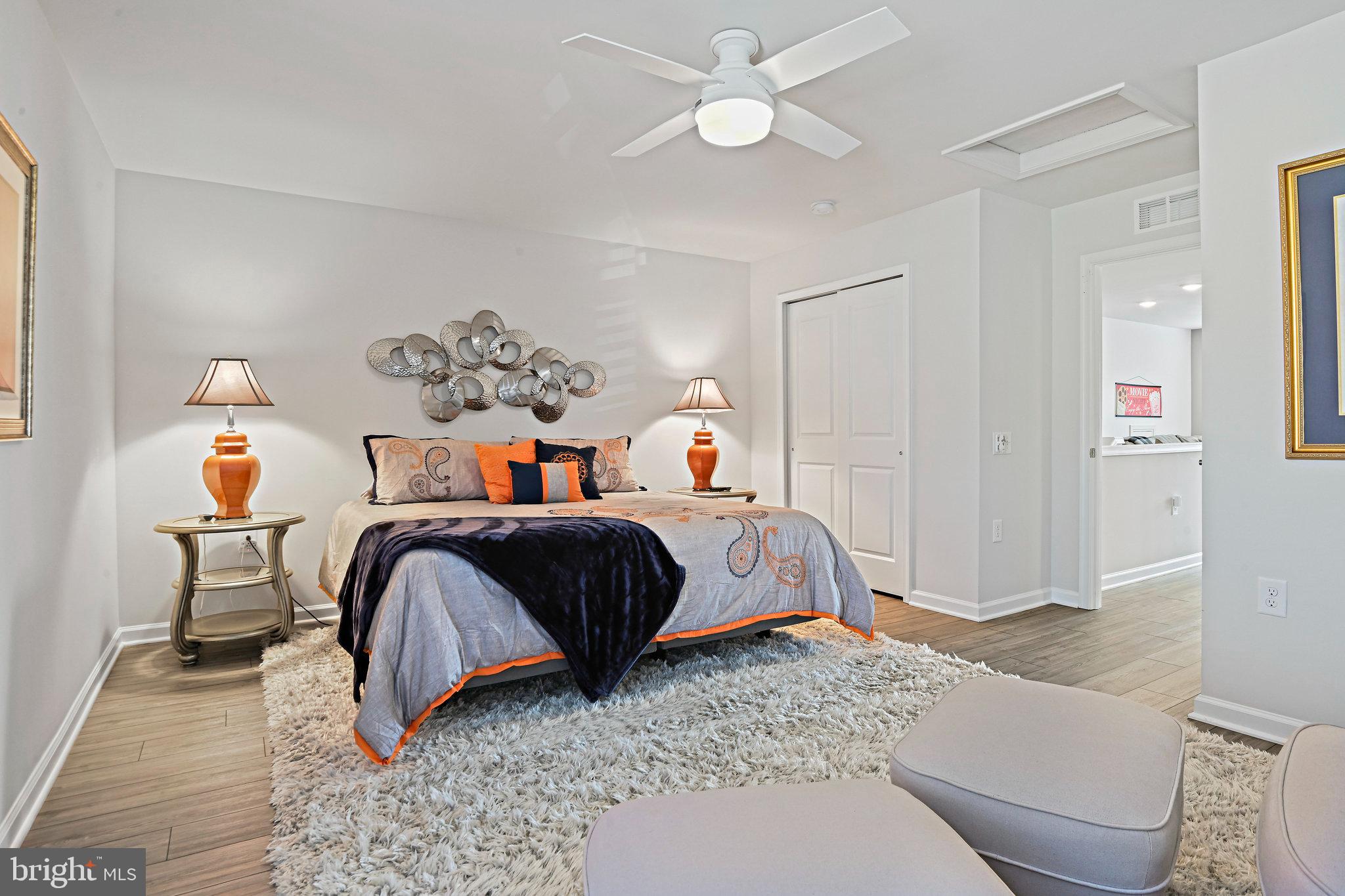 15788 Gardenia Rdg Way Haymarket, VA 20169 - Photo 27 of 50 a bedroom with a bed and wooden floor