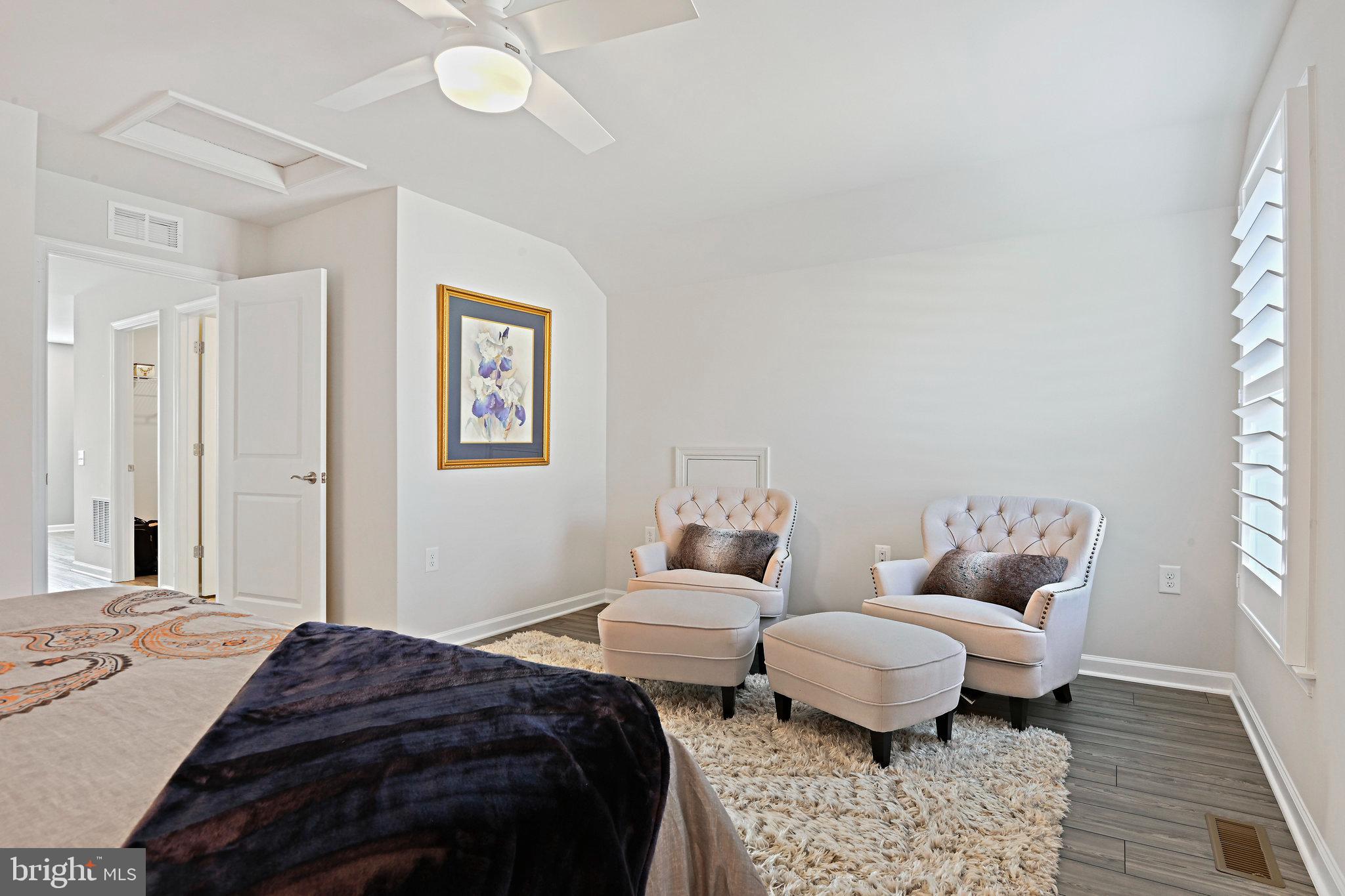 15788 Gardenia Rdg Way Haymarket, VA 20169 - Photo 28 of 50 a bedroom with a bed and wooden floor