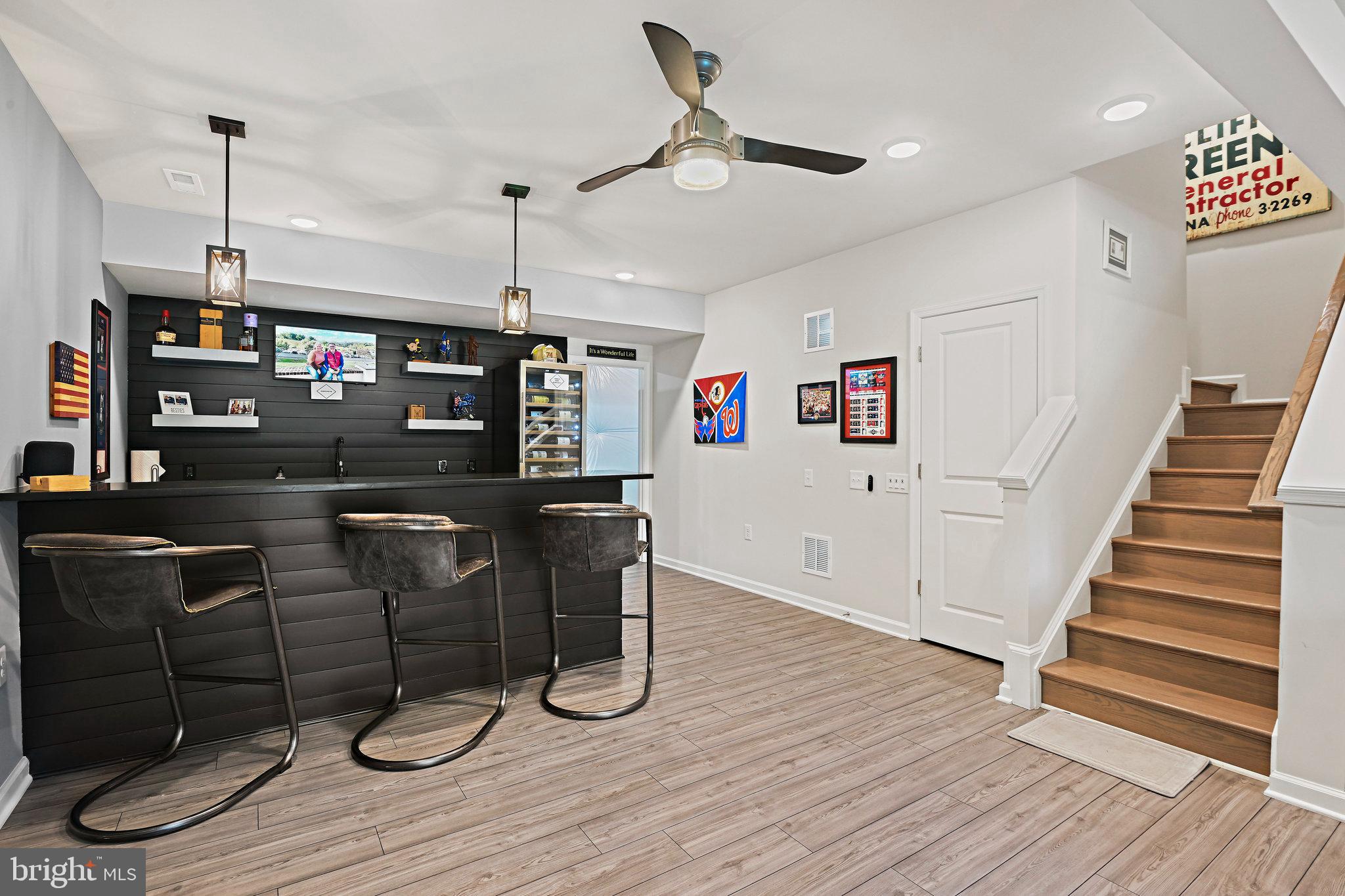 15788 Gardenia Rdg Way Haymarket, VA 20169 - Photo 30 of 50 a view of a livingroom with furniture wooden floor and staircase