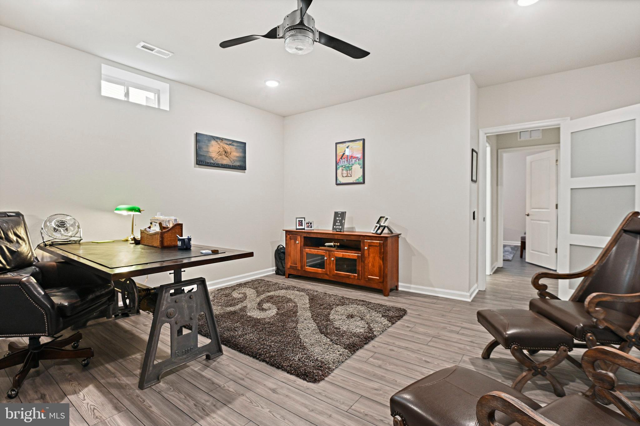 15788 Gardenia Rdg Way Haymarket, VA 20169 - Photo 36 of 50 a living room with furniture and a flat screen tv