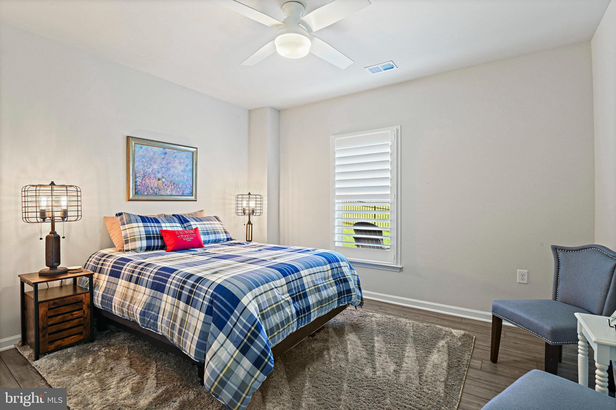 15788 Gardenia Rdg Way Haymarket, VA 20169 - Photo 37 of 50 a bedroom with a bed and a chandelier