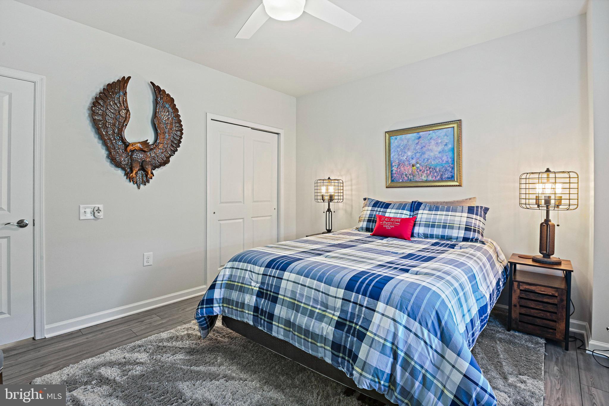 15788 Gardenia Rdg Way Haymarket, VA 20169 - Photo 38 of 50 a bedroom with a bed and a painting on the wall