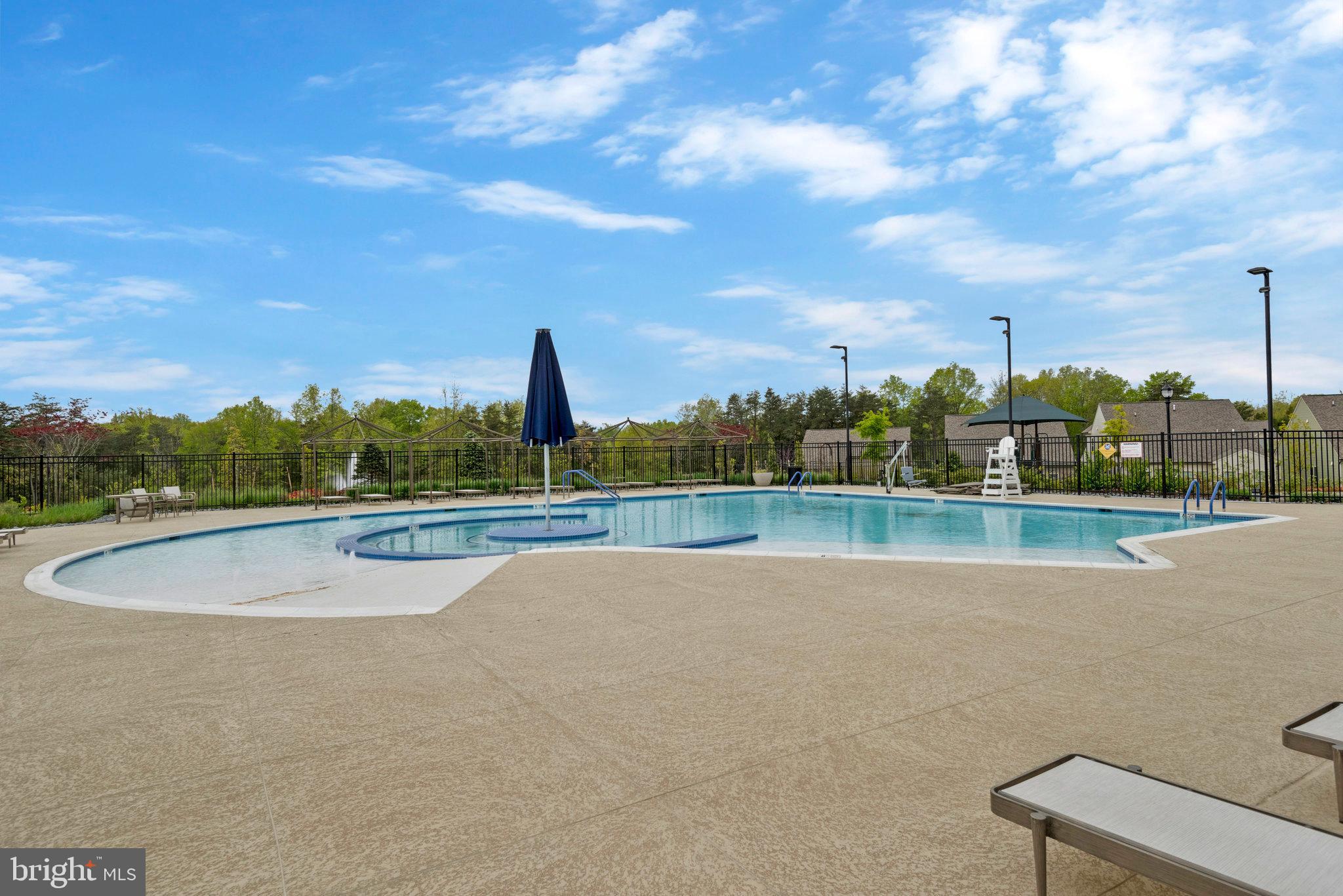 15788 Gardenia Rdg Way Haymarket, VA 20169 - Photo 49 of 50 a view of a swimming pool and a yard