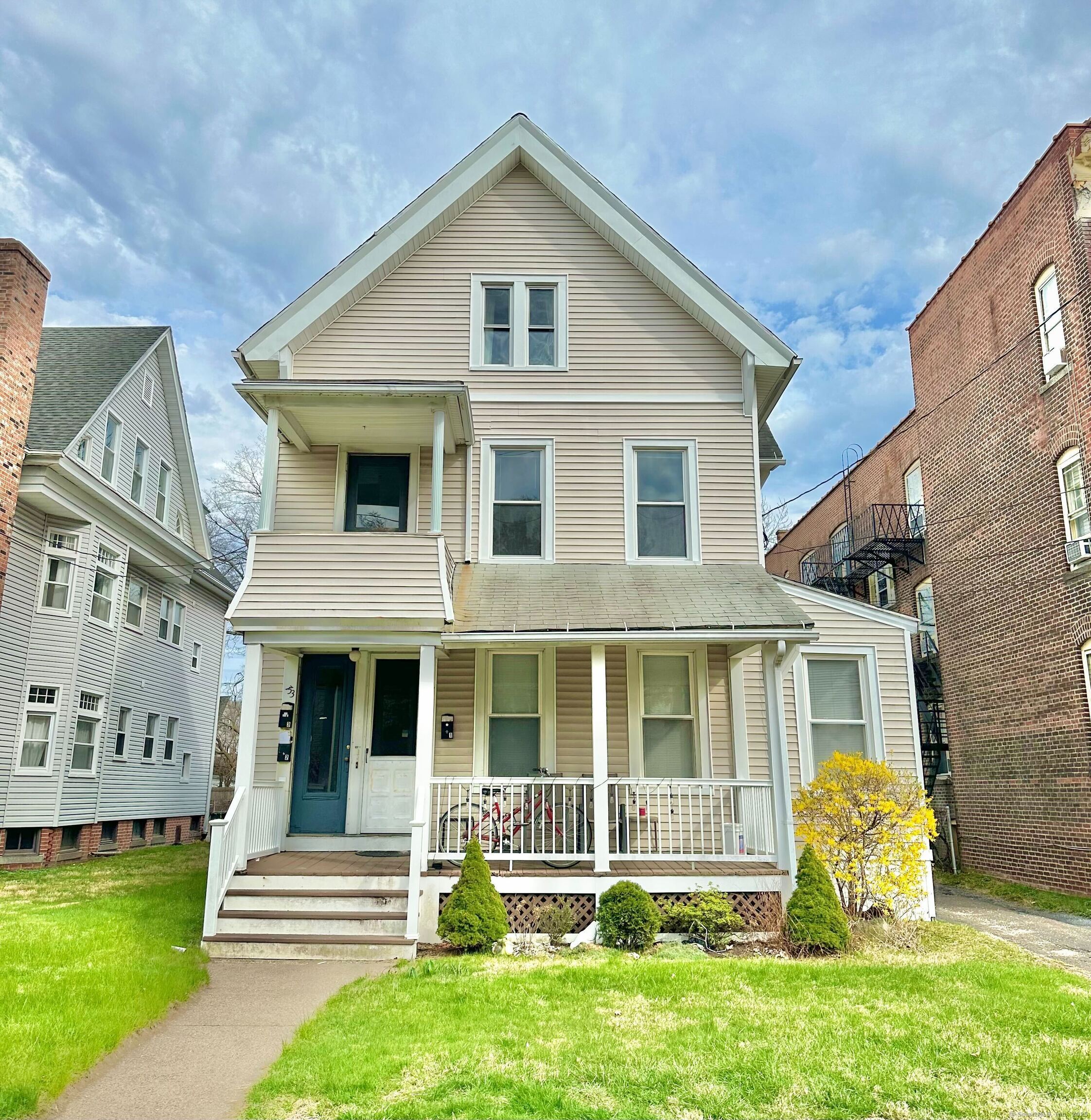 a front view of a house with a yard