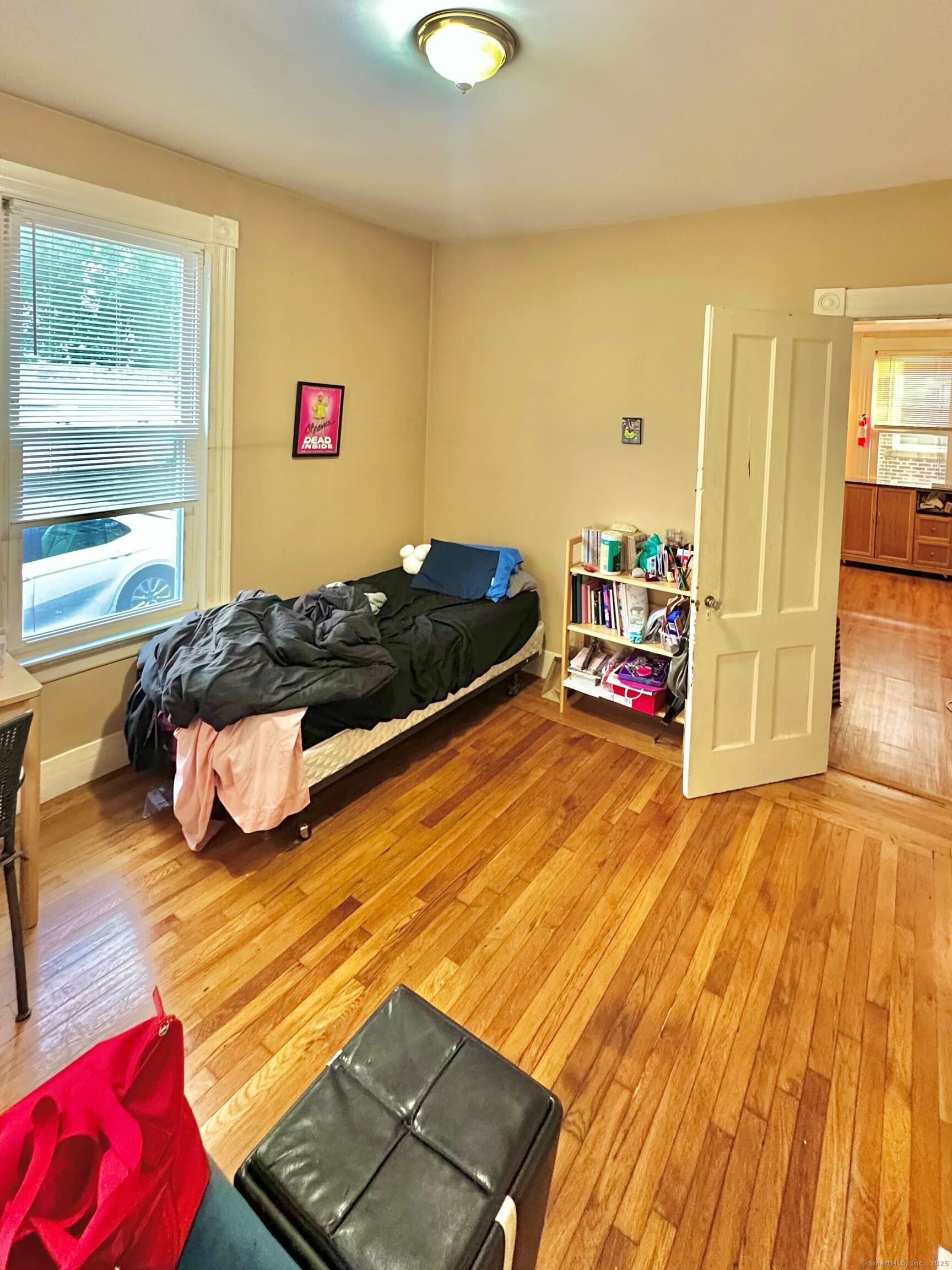 751 Orange Street, Unit 1 New Haven, CT 06511 - Photo 18 of 19 a bedroom with a bed and wooden floor