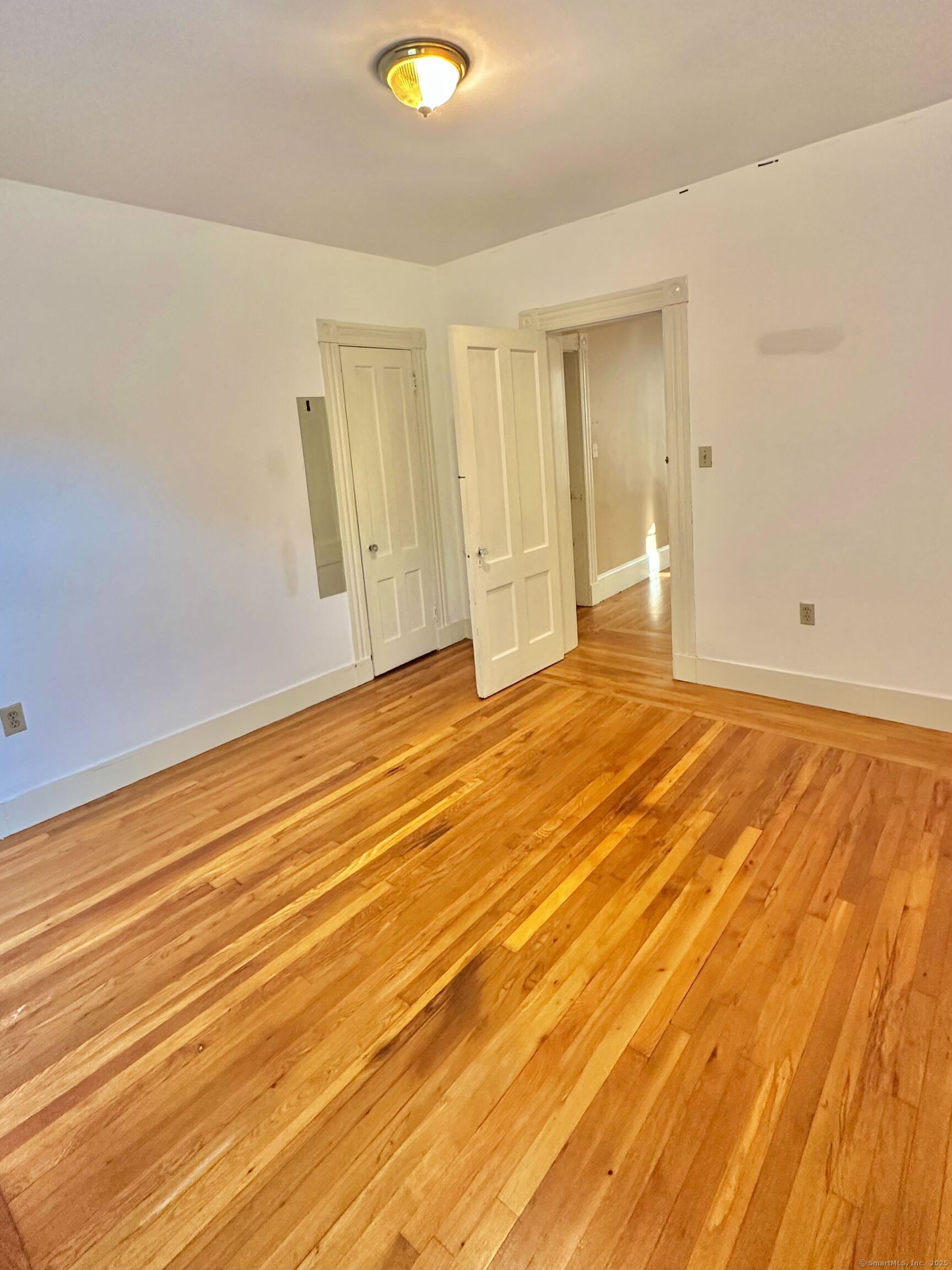 751 Orange Street, Unit 1 New Haven, CT 06511 - Photo 4 of 19 a view of an empty room with wooden floor