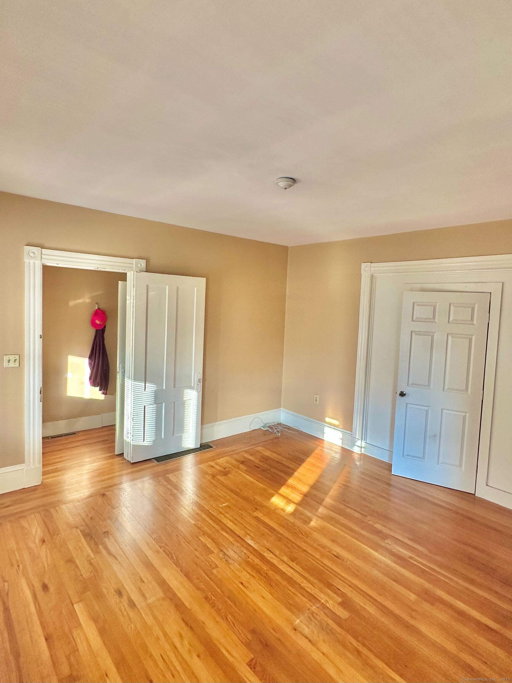 751 Orange Street, Unit 1 New Haven, CT 06511 - Photo 9 of 19 a view of empty room with wooden floor