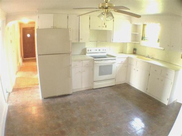 420 Parker Street Springfield, MA 01129 - Photo 4 of 16 a kitchen with a refrigerator a stove a sink and dishwasher