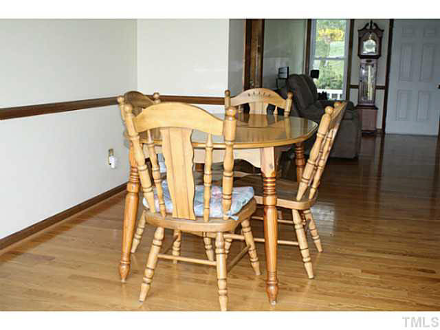 You will enjoy entertaining guests in this open and spacious dining area which features lovely wood trim crown molding and chair railing. Dining Room