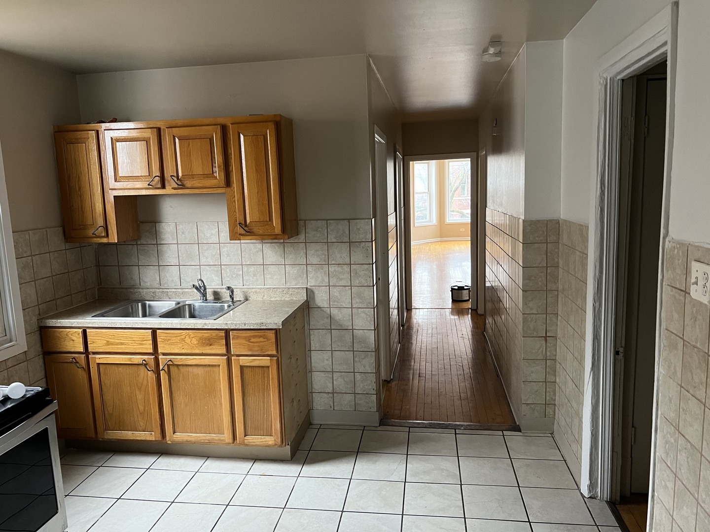 Undisclosed Address Chicago, IL 60624 - Photo 10 of 16 a bathroom with a sink a toilet and mirror