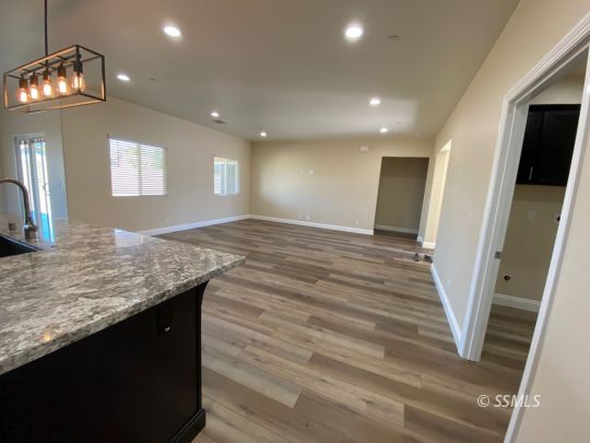 1045 Ocean Avenue Ridgecrest, CA 93555 - Photo 9 of 12 a bathroom with a sink a vanity and a mirror