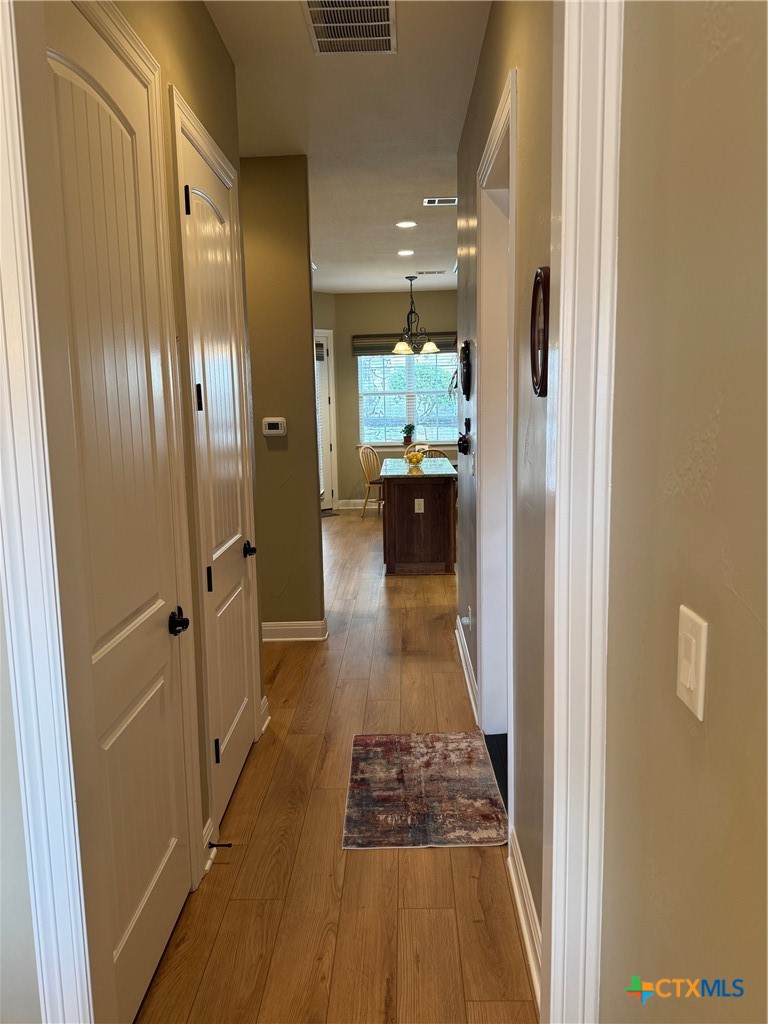 2306 Arroyo Grande Leander, TX 78641 - Photo 15 of 44 a view of a hallway with wooden floor