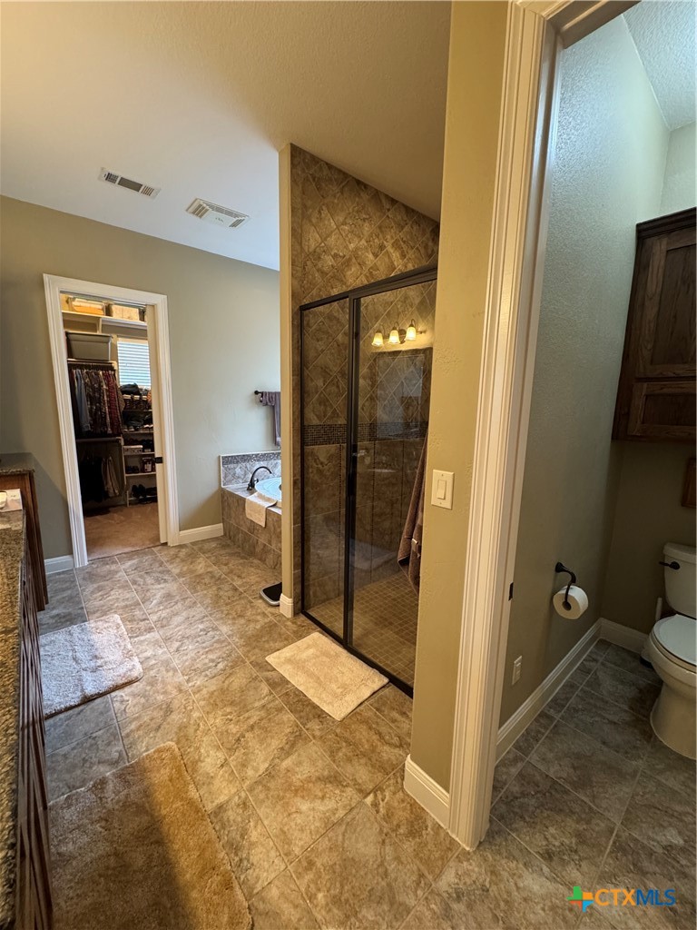 2306 Arroyo Grande Leander, TX 78641 - Photo 21 of 44 a bathroom with a sink and toilet